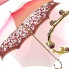 Fantastico ombrello rosa chiaro con speciale manico a fiori